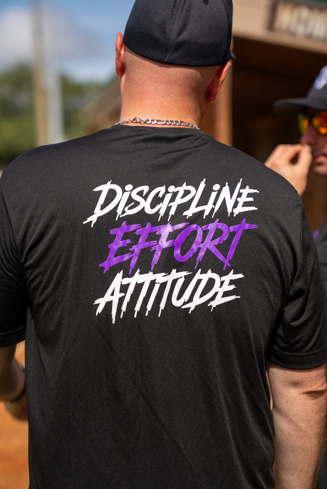 Diamond Elite Academy athlete wearing the team's Discipline, Effort, Attitude shirt