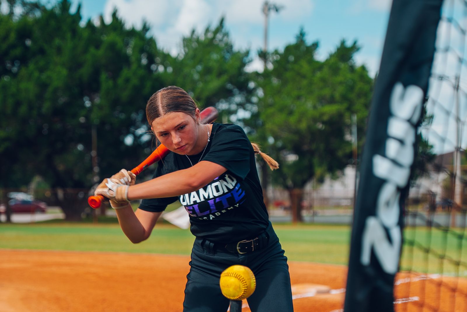 Diamond Elite Academy softball player swinging